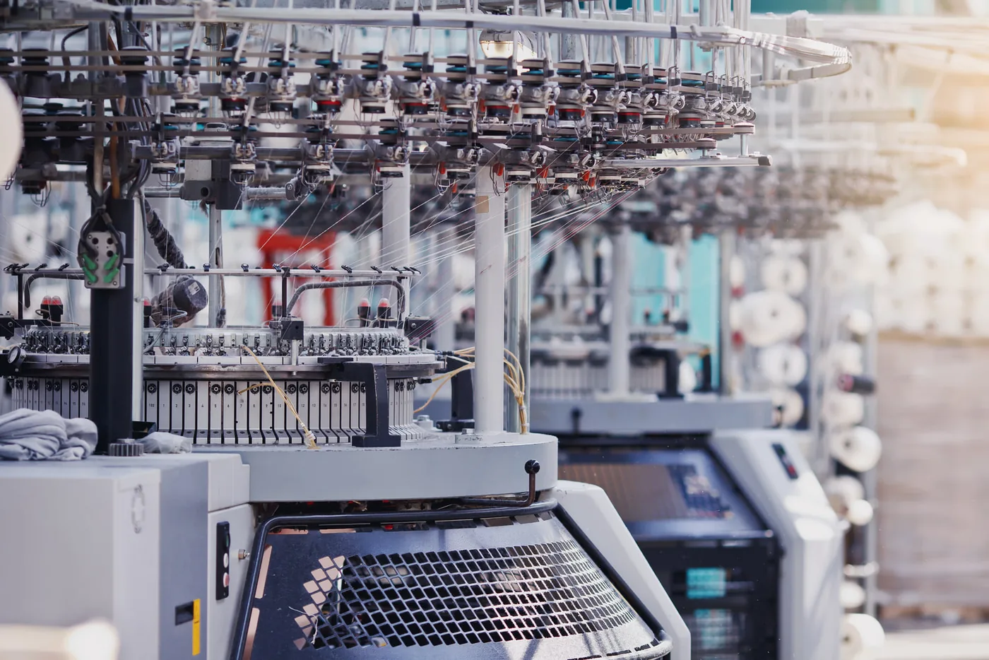 A circular knitting machine producing fabric