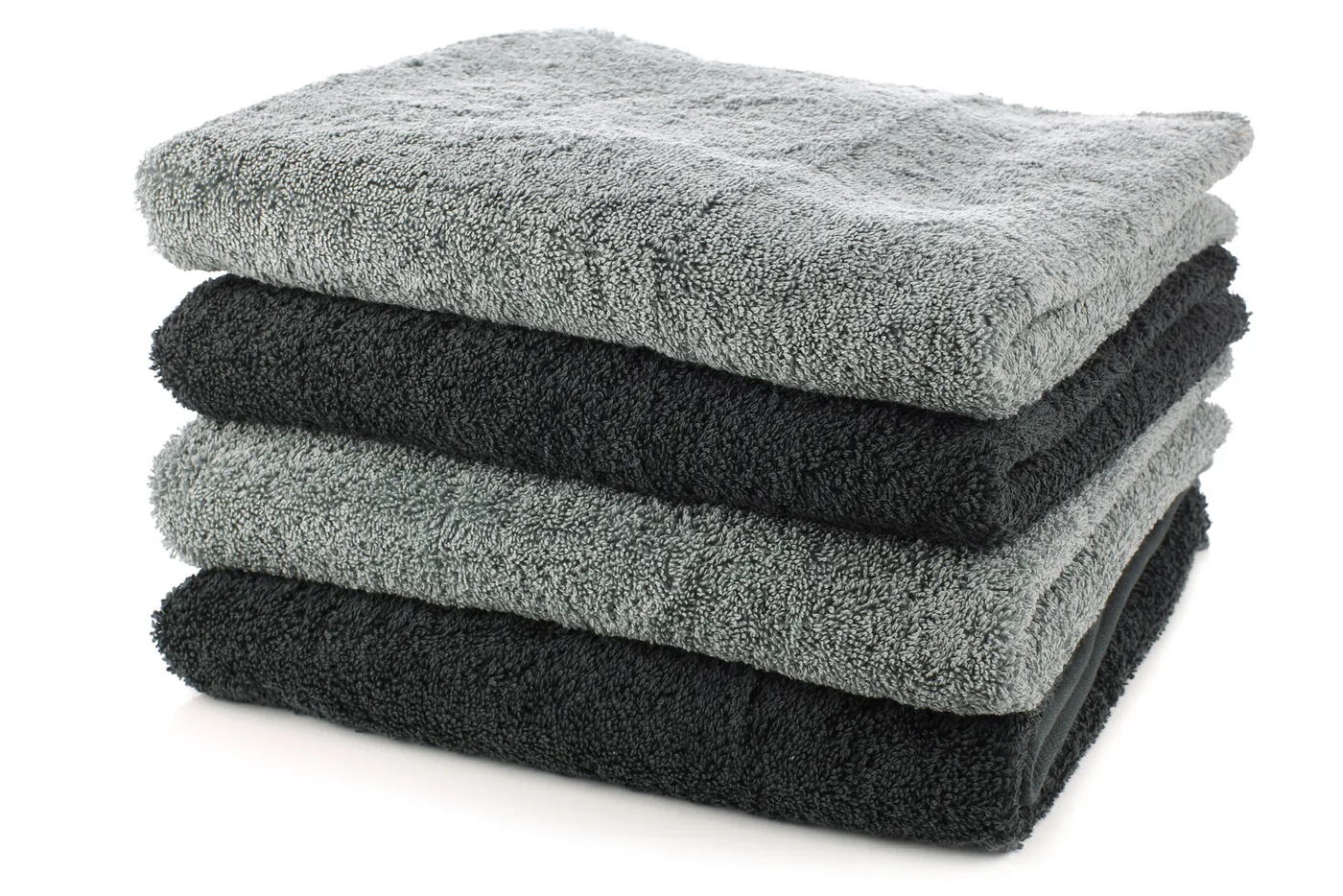 A stack of folded charcoal and grey towels